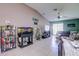 This cozy living room features lots of space, neutral paint, tile flooring and is open to the kitchen at 680 Argyll Dr, Spring Hill, FL 34609