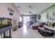 The living room features neutral paint, lots of natural light, and is open to the kitchen, great for entertaining at 680 Argyll Dr, Spring Hill, FL 34609