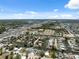 Overhead view of a coastal community featuring waterfront homes, canals, and a nearby highway at 6816 Sanderling Ln, Hudson, FL 34667