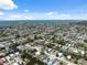 Wide aerial shot of a coastal community with homes nestled along canals and leading to open water at 6816 Sanderling Ln, Hudson, FL 34667