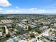 Panoramic aerial view of a waterfront community with canals, homes, and access to open water under a sunny sky at 6816 Sanderling Ln, Hudson, FL 34667