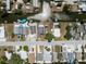 Bird's-eye view of homes along a canal, showcasing docks, boats, and waterfront living at 6816 Sanderling Ln, Hudson, FL 34667