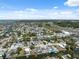Aerial shot capturing waterfront homes with boat docks and canal access, highlighting coastal living at 6816 Sanderling Ln, Hudson, FL 34667