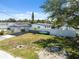 Exterior shot showcasing the home's fenced in yard, boat and carport at 6816 Sanderling Ln, Hudson, FL 34667