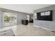 Living area with sliding glass doors offering views of the outdoors and access to the yard at 6816 Sanderling Ln, Hudson, FL 34667