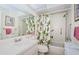 Bright bathroom featuring a shower/tub, a toilet, and mirror at 7529 Greystone Dr # A, Hudson, FL 34667