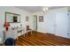 Bright bedroom featuring wood floors, a ceiling fan and furniture at 7529 Greystone Dr # A, Hudson, FL 34667