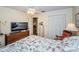 Comfortable bedroom with a TV, a closet, and furniture at 7529 Greystone Dr # A, Hudson, FL 34667