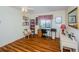 Comfortable bedroom featuring wood floors, a window, and furniture at 7529 Greystone Dr # A, Hudson, FL 34667