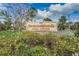 Beacon Woods Civic Center sign set amid lush landscaping on a sunny day at 7529 Greystone Dr # A, Hudson, FL 34667