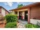 Charming entrance with a cozy seating area and a well-maintained exterior at 7529 Greystone Dr # A, Hudson, FL 34667