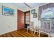 Warm entryway featuring wood flooring, a decorative door, and quaint seating at 7529 Greystone Dr # A, Hudson, FL 34667
