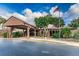 Community civic center featuring a porte-cochere entry and an American flag at 7529 Greystone Dr # A, Hudson, FL 34667