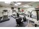 Community gym featuring treadmills, stationary bikes, and mirrored walls at 7529 Greystone Dr # A, Hudson, FL 34667