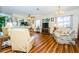 Bright living room with an open view of kitchen and dining area at 7529 Greystone Dr # A, Hudson, FL 34667