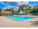 The community pool sparkles with its blue water under blue skies at 7529 Greystone Dr # A, Hudson, FL 34667