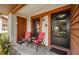 Inviting porch featuring a seating area and a well-lit entrance at 7529 Greystone Dr # A, Hudson, FL 34667