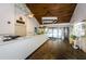 Bright reception area with brick flooring, wood ceilings, and a service counter at 7529 Greystone Dr # A, Hudson, FL 34667