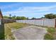 Large backyard featuring a large patio space and full privacy fence at 9001 Lido Ln, Port Richey, FL 34668