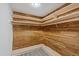 Walk-in closet clad in wood with wrap around shelving offering plenty of storage at 9001 Lido Ln, Port Richey, FL 34668