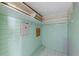 Storage closet with a hanging rack and storage shelves for optimal organization at 9001 Lido Ln, Port Richey, FL 34668