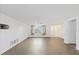Open living space with tile floors, ceiling fan, and plentiful windows at 9001 Lido Ln, Port Richey, FL 34668
