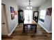 Elegant dining room with modern chandelier, art-deco decorations, and lots of natural light at 9089 Dupont Ave, Spring Hill, FL 34608