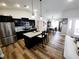 Modern kitchen with black cabinetry, stainless steel appliances, and a large island with bar seating at 9089 Dupont Ave, Spring Hill, FL 34608