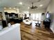 Bright living room featuring wood floors, recessed lighting, a ceiling fan, and an open layout at 9089 Dupont Ave, Spring Hill, FL 34608