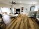 Bright living room features wood floors, neutral paint, high ceilings and access to patio at 9089 Dupont Ave, Spring Hill, FL 34608