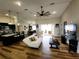 Bright and open floor plan showcases the living room, kitchen, and dining room with a modern design at 9089 Dupont Ave, Spring Hill, FL 34608