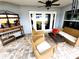 Covered patio with furnishings and bar area provides perfect outdoor entertaining space at 9089 Dupont Ave, Spring Hill, FL 34608