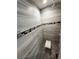 Modern shower with stylish tile work, mosaic accents, and a convenient built-in seat at 9089 Dupont Ave, Spring Hill, FL 34608