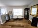 Cozy sitting area featuring wood floors, comfortable seating, and natural light from a window at 9089 Dupont Ave, Spring Hill, FL 34608
