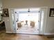 Sliding glass doors open onto outdoor patio with seating area and view of backyard at 9089 Dupont Ave, Spring Hill, FL 34608