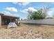 Spacious backyard with white fence and enclosed patio, perfect for outdoor activities at 9100 Whitman Ln, Port Richey, FL 34668