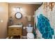 Bathroom featuring a wood vanity with granite countertop and shower curtain with a sea turtle at 9100 Whitman Ln, Port Richey, FL 34668