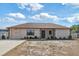 Charming single-story home featuring a well-manicured lawn and an attached one-car garage at 9100 Whitman Ln, Port Richey, FL 34668