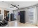 Office with tile floors, ample storage cabinets, a safe, and large windows at 9100 Whitman Ln, Port Richey, FL 34668
