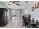 Bright office space with tile floors, sliding glass doors to the patio, and ample workspace at 9100 Whitman Ln, Port Richey, FL 34668