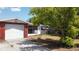 Charming home featuring a red brick accent wall, screened porch, and a well-manicured lawn at 9104 Lido Ln, Port Richey, FL 34668