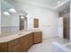 Bright bathroom featuring double sinks, lots of cabinet space and granite counters at 9237 Penelope Dr, Weeki Wachee, FL 34613