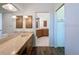 Bright bathroom with a large vanity, lots of cabinet space, and a door to the toilet and shower rooms at 9237 Penelope Dr, Weeki Wachee, FL 34613