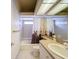 Bright bathroom with shower and tub combination and neutral color palette at 9237 Penelope Dr, Weeki Wachee, FL 34613