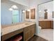 Elegant bathroom featuring a large mirror, cabinets, vanity area, and a well-lit space at 9237 Penelope Dr, Weeki Wachee, FL 34613