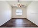 Bright bedroom with modern ceiling fan and wood-look flooring at 9237 Penelope Dr, Weeki Wachee, FL 34613