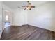 Bright bedroom with modern ceiling fan and wood-look flooring at 9237 Penelope Dr, Weeki Wachee, FL 34613