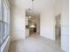 The dining room is light and bright, with tile floors and a view into the kitchen area at 9237 Penelope Dr, Weeki Wachee, FL 34613