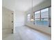 The dining room features tile floors and large windows offering great natural light at 9237 Penelope Dr, Weeki Wachee, FL 34613