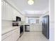 Updated kitchen boasts white cabinets, stainless steel appliances, and a functional design at 9237 Penelope Dr, Weeki Wachee, FL 34613